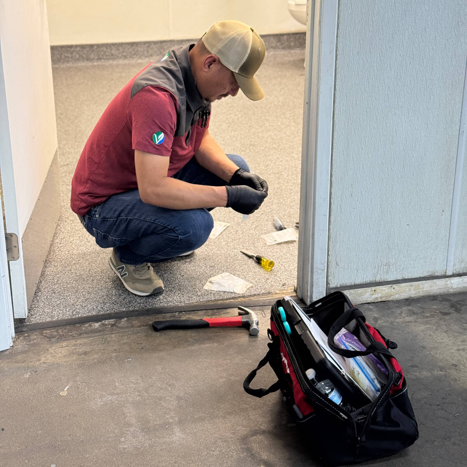 Environmental technician performing controlled sampling of building materials to test for hazardous substances.