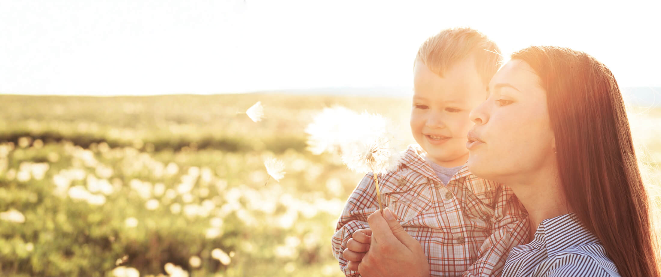 Mother with her child in sunlight